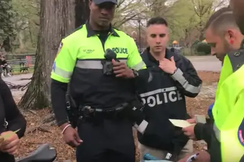 NYPD officers issue tickets to cyclists for lacking bells, and confiscate their bikes
